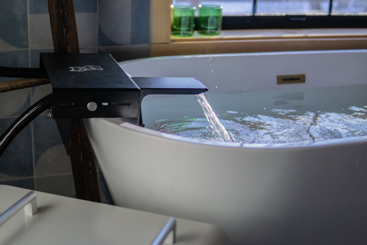 Close-up of Absolute Zero adapter pouring into bathtub